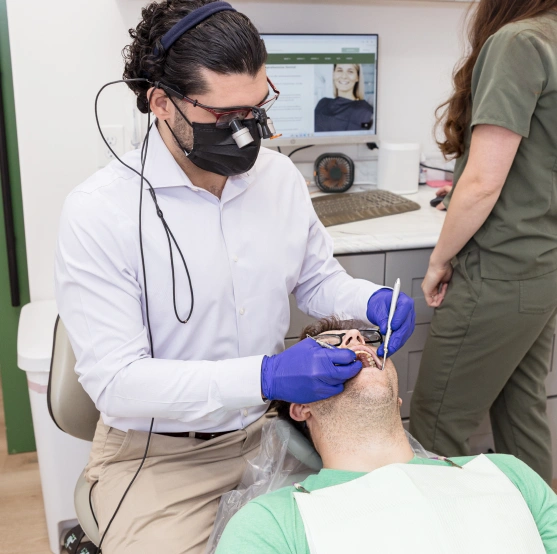 Dentist performing a bone grafting procedure
