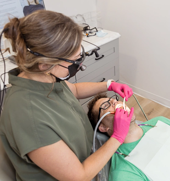 Dentist performing a dental bonding procedure