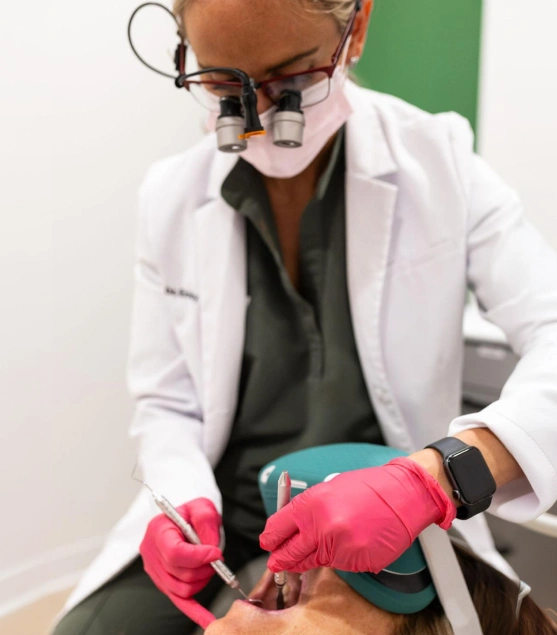 Dentist performing a routine dental checkup on a patient
