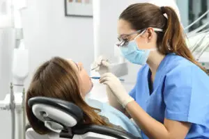 Dental hygienist performing a professional teeth cleaning