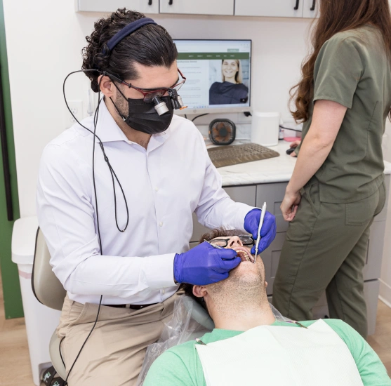Dentist providing emergency dental treatment to a patient