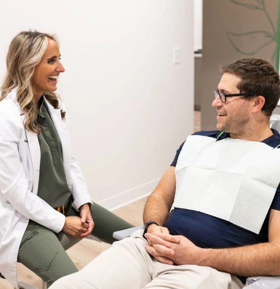 Dentist discussing restorative dentistry treatment with a patient