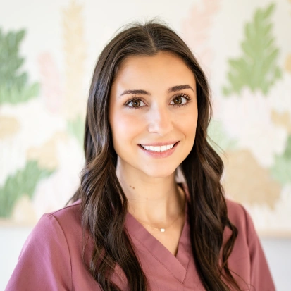 Portrait of Sam, a friendly dental team member welcoming patients