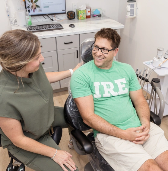 Dentist discussing smile makeover options with a patient