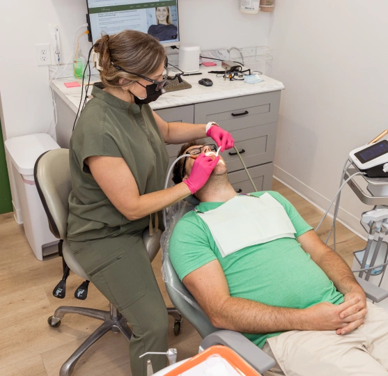 Dentist performing a tooth extraction procedure