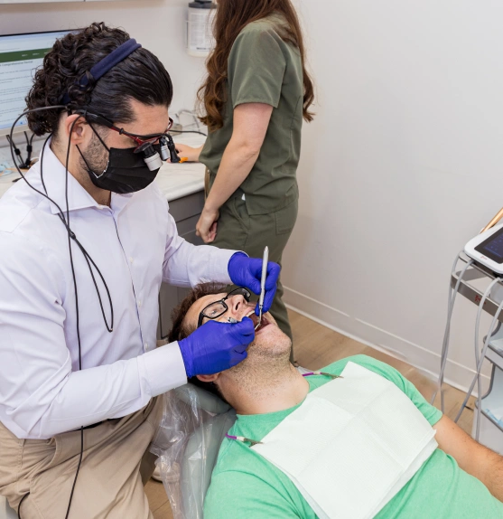Dentist performing a wisdom tooth removal procedure